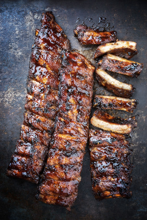 Gooey, smoky BBQ ribs glazed with Boutique Sauces Beef & Rib Sauce. Perfect for slow-cooked, fall-off-the-bone tenderness