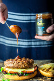 Rich, smoky BBQ marinade dripping onto a juicy beef burger. Boutique Sauces Beef & Rib Sauce – perfect for grilling, burgers, and barbecue