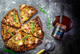 Smoky BBQ pizza topped with chicken, bacon, salami, and fresh rocket, made with Boutique Sauces Beef & Rib Sauce as the base. A bold, flavorful twist on pizza night