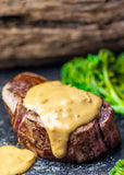 Juicy steak topped with creamy Diane sauce with buttery leek by Boutique Sauces. A rich, gourmet sauce perfect for steak lovers