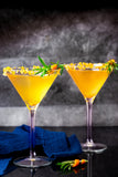 Orange martinis with a spiced citrus twist, made using Boutique Sauces Orange Star Anise Sauce. A unique cocktail recipe for martini lovers