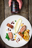Seared duck breast with red wine jus, pear, and velvety purée, elegantly plated. Boutique Sauces Red Wine Jus adds a rich, gourmet touch to this dish.