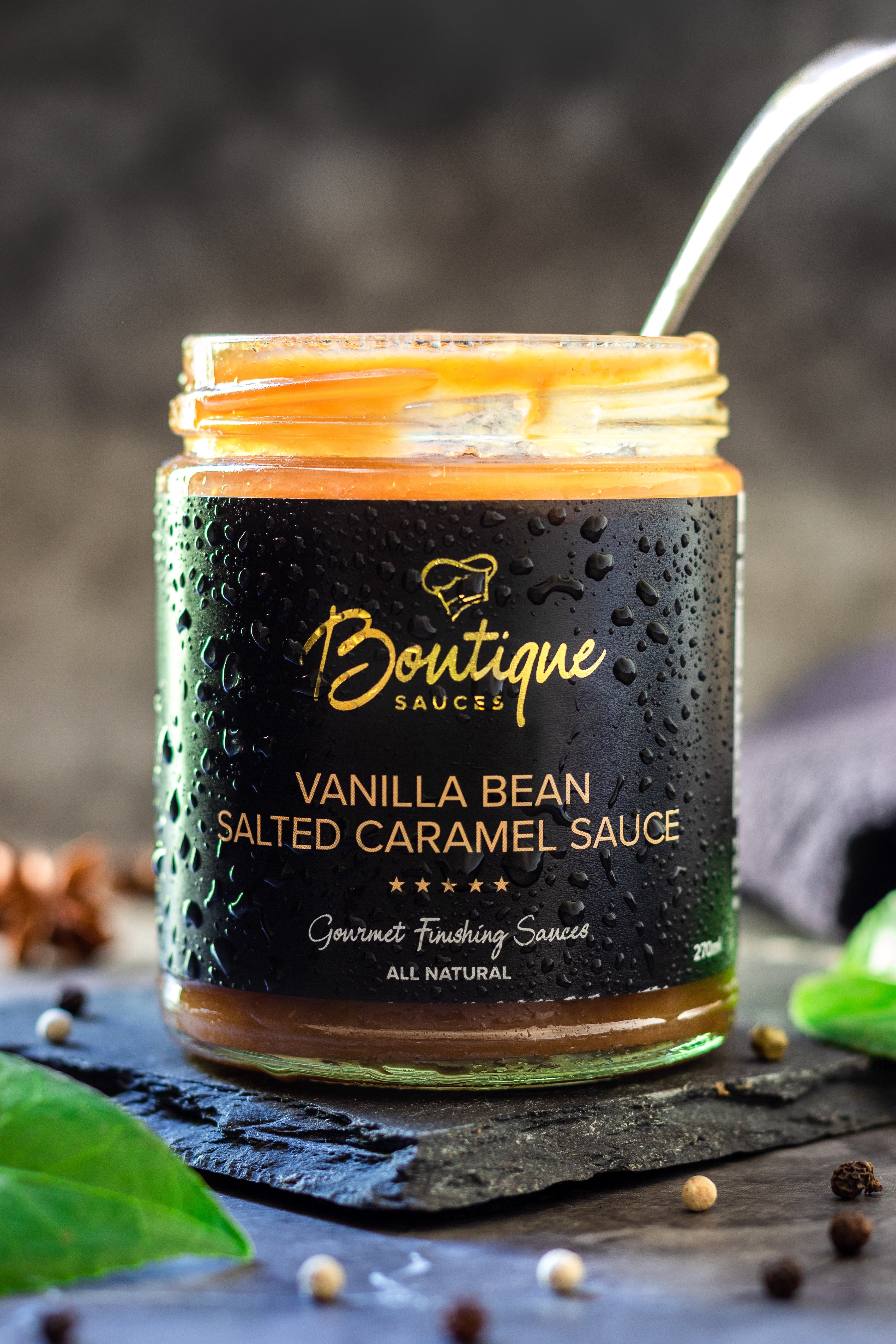 Authentic Vanilla Bean Salted Caramel Sauce in a jar by Boutique Sauces. A rich and creamy gourmet caramel, perfect for sticky date pudding, desserts, and ice cream