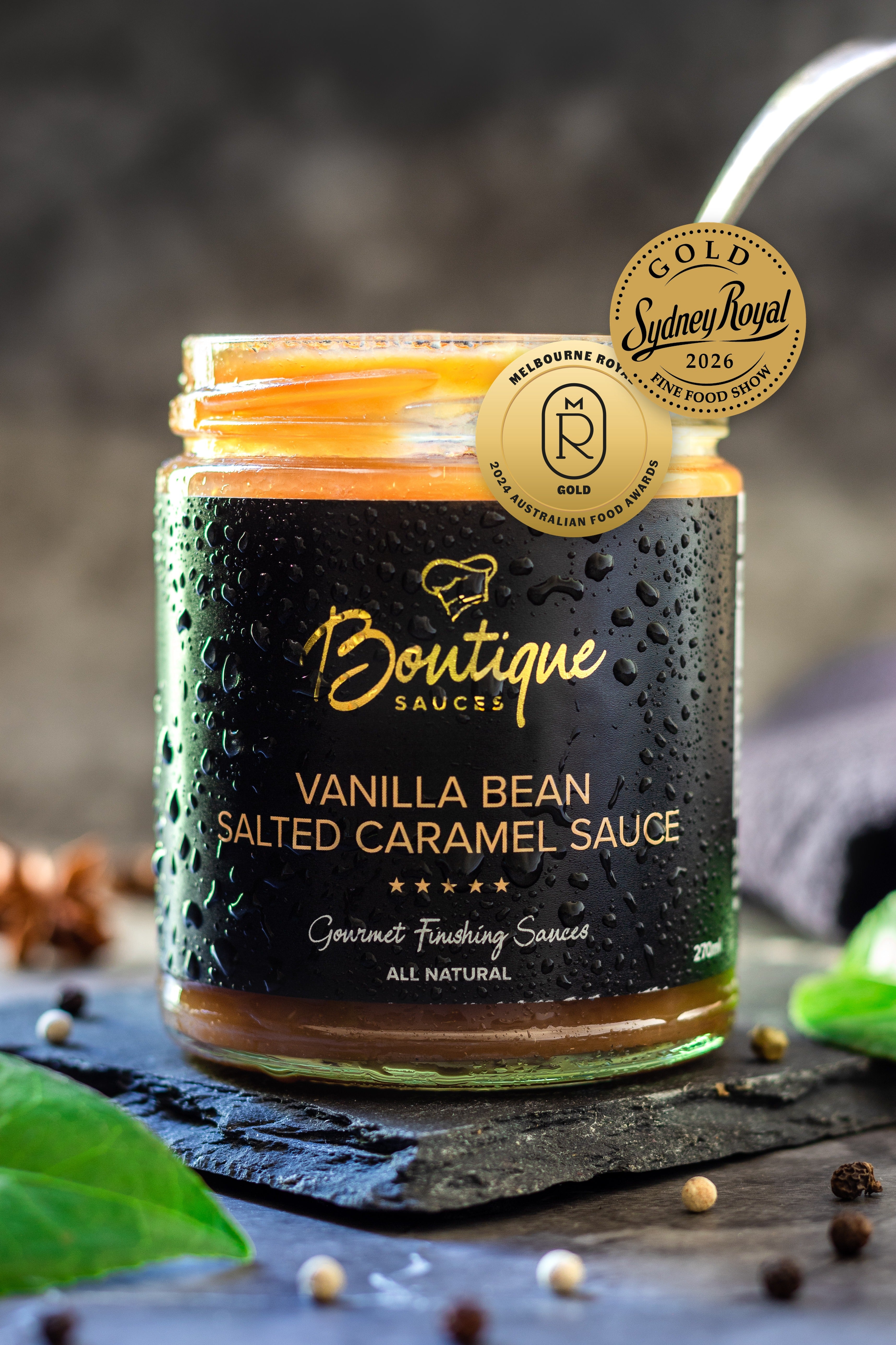 Vanilla Salted Caramel Sauce jar by Boutique Sauces with its award medals. Chef-made dessert sauce for puddings and ice cream.